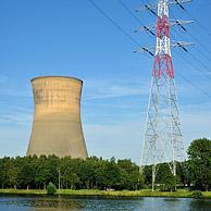 High voltage pylon and cooling tower of the Electrabel power station along the Ghent-Terneuzen Canal at Ghent seaport, Belgium